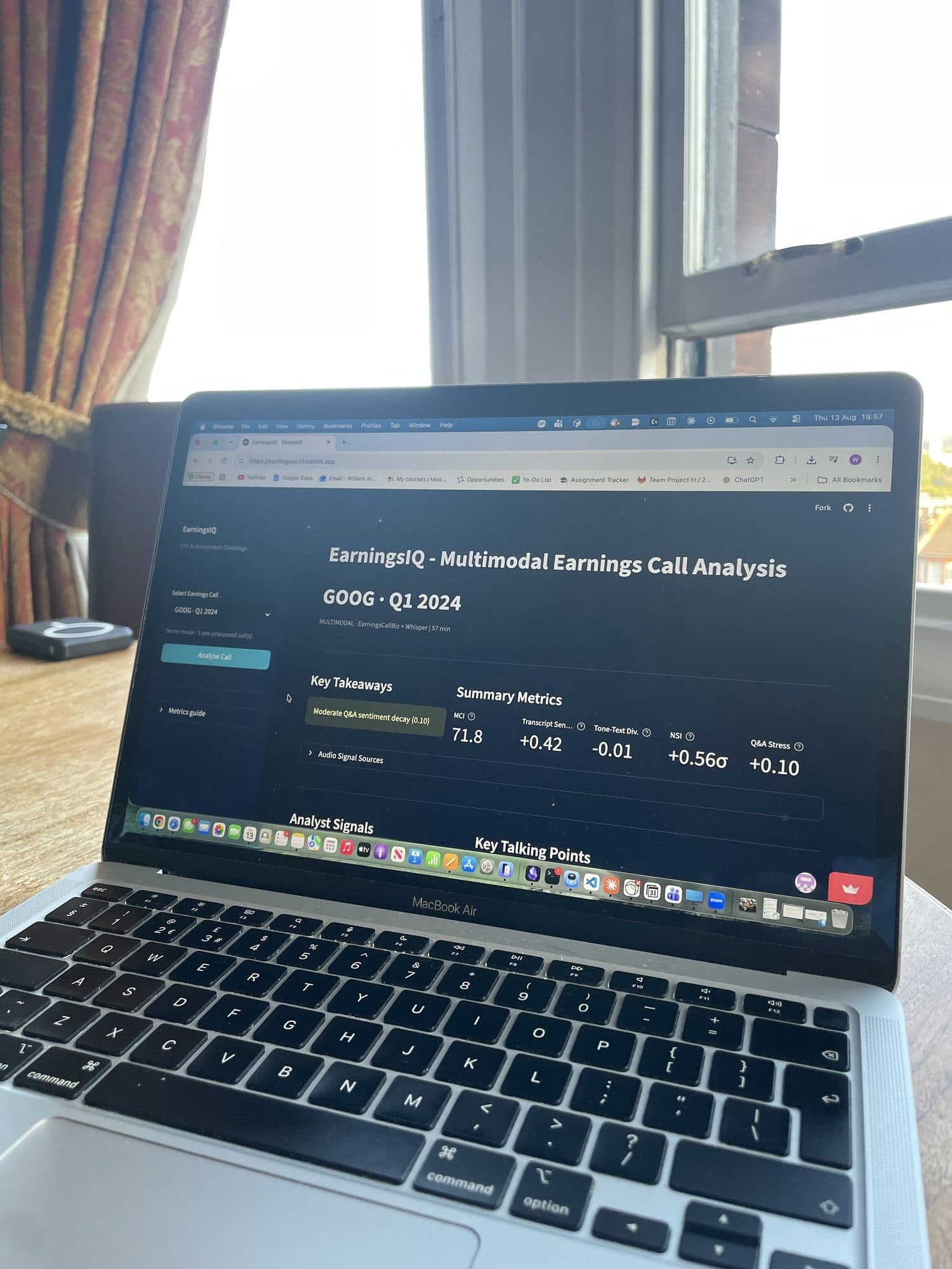 A laptop displaying the EarningsIQ dashboard for Google's Q1 2024 earnings call, showing key takeaways and summary metrics.